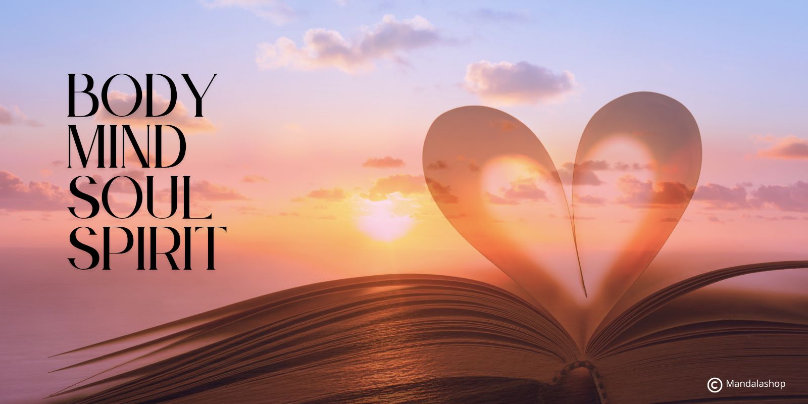 Livre ouvert en forme de cœur avec les mots body, mind, soul, spirit, symbole d’alignement intérieur et de sagesse incarnée